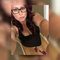 Woman wearing glasses and black top