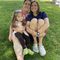 Family sitting together on grass
