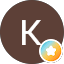 Brown circle with K and star