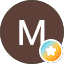 M icon with colorful star symbol
