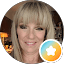 Blonde woman with bangs smiling